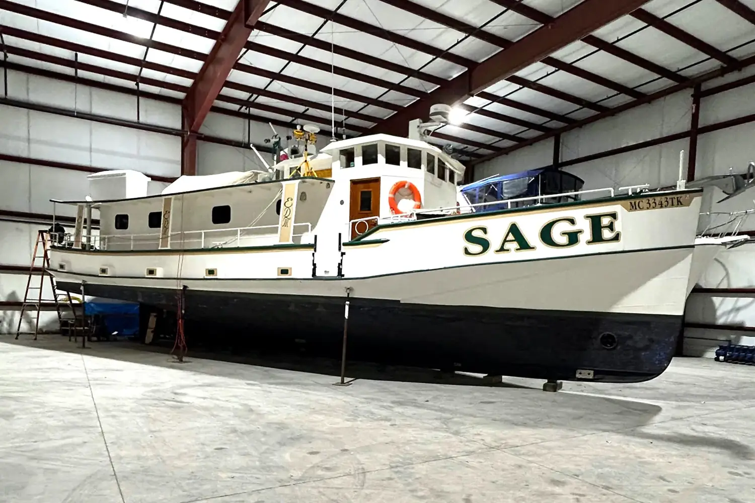 Sage hauled out in indoor storage showing full keel