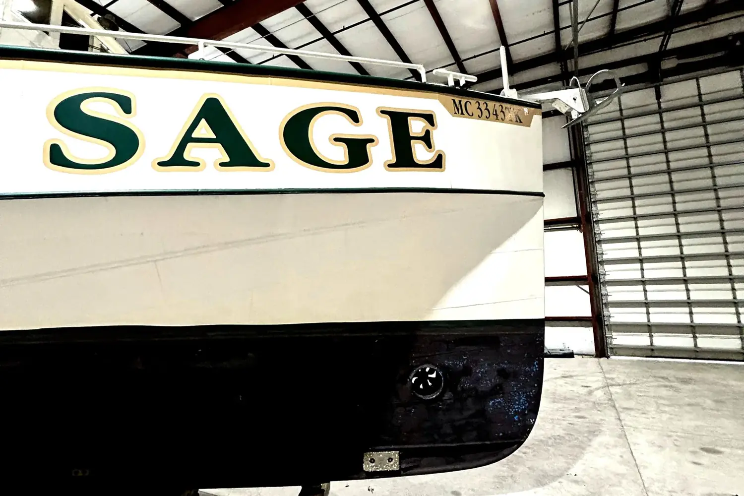 Sage's bow and topsides ashore in indoor storage