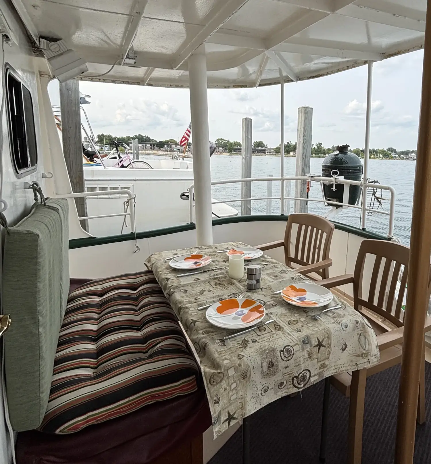 Breakfast set on Sage's covered aft deck overlooking the water