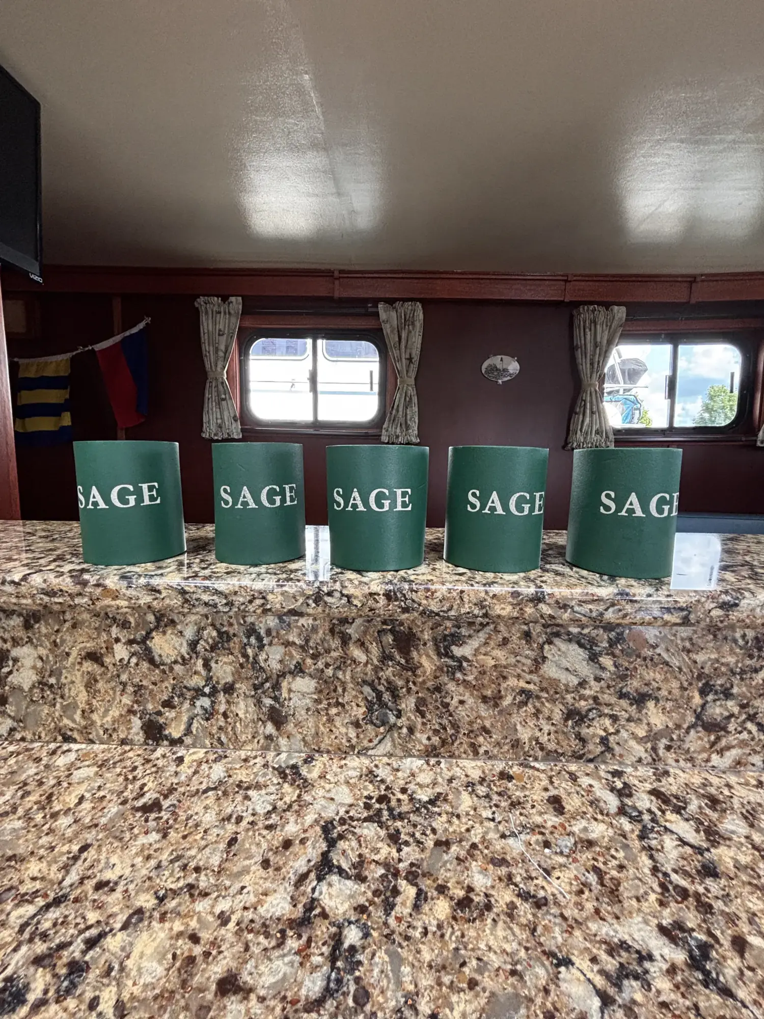SAGE-lettered canisters on the galley counter